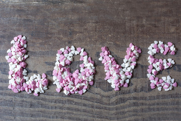 Word love with candy hearts