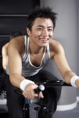 Fototapeta na wymiar Happy Young Man Exercising 