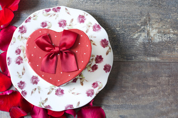Gift box with heart shape and petals