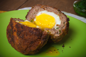 Fried cutlet  with egg inside served on a plate. Selective focus