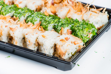 close-up of sushi roll in the black box, Sushi delivery. shallow