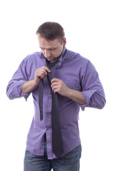 Man tying a tie