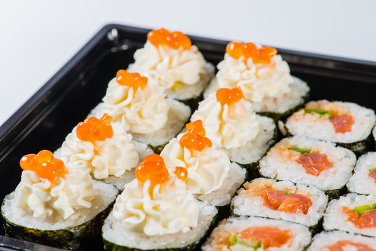 close-up of sushi roll in the black box, Sushi delivery. shallow