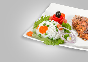 Chicken fillet on plate isolated on gray background