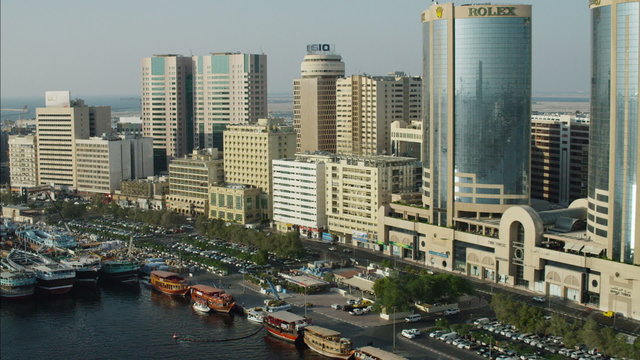 Aerial Dhows anchored Dubai Creek Waterfront city buildings UAE