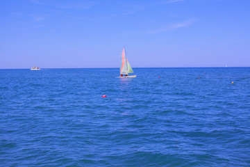 A small sailing yacht.