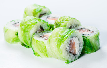 close-up of  Japan sushi roll with salmon and green lettuce (sha