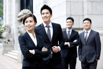 Confident business team looking at view outdoors, Hong Kong