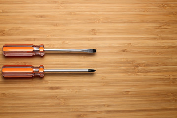 screwdrivers on wooden background