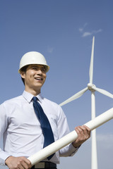 Engineer in front of wind turbines