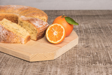 Slices of clementine cake with powdered sugar topping. Cake on a