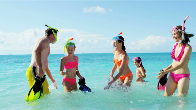 Caucasian male female family children sisters travel recreation ocean snorkeling