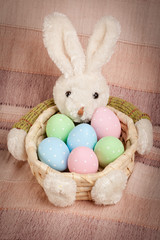 Easter basket with decorated eggs and the Easter bunny