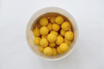 Pot of Yellow Carp Fishing Bait Boilie Balls