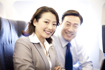 Fototapeta premium Businesspeople on a plane