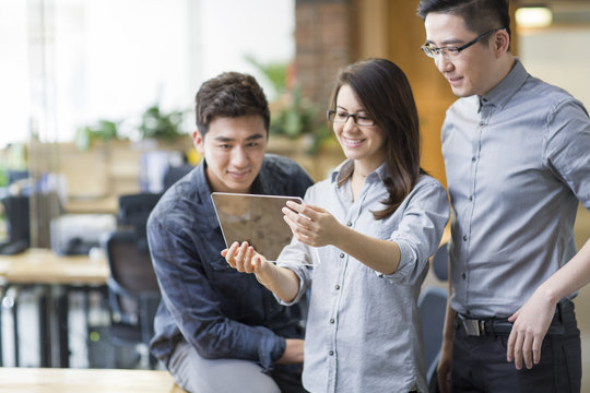 IT workers developing digital tablet