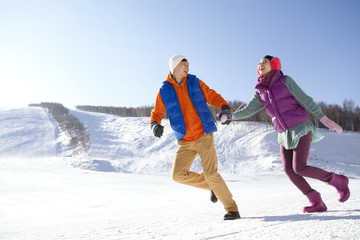 Happy young couple in ski resort