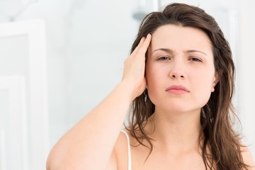 Naklejka premium Woman looking at the mirror