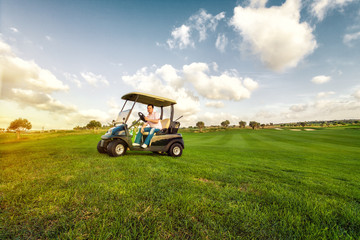 golf man in cart is watching