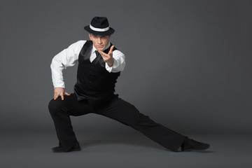 Obraz na płótnie Canvas Young male professional dancer dancing in studio.