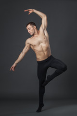 Modern ballet dancer in studio.