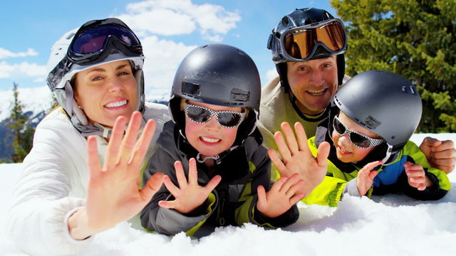 portrait snow outdoor lifestyle Caucasian family sons mountains sport promotion
