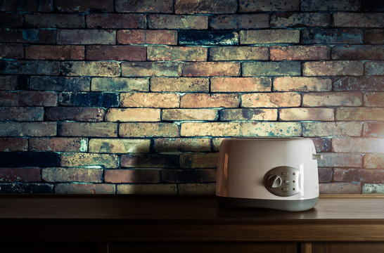 Toaster on wooden cupboard in kitchen room