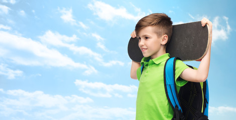 happy student boy with backpack and skateboard