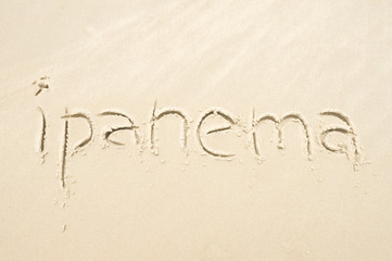 Fototapeta na wymiar Ipanema, the famous beach, message handwritten on smooth sand in Rio de Janeiro, Brazil