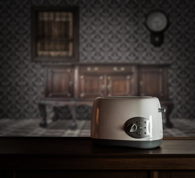 Toaster on wooden cupboard