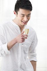 Happy young man with champagne