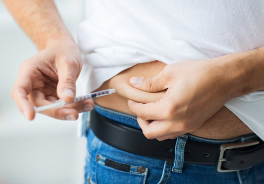 Man With Syringe Making Insulin Injection