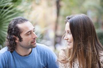 Fototapeta premium Young couple in love outdoor looking to each other