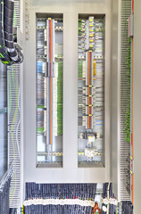 Electrical terminals and wires in industrial control panel closeup