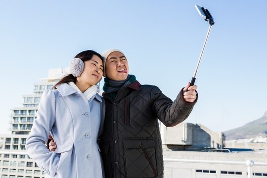 Couple making funny face and clicking pictures
