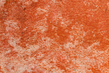 The background of grunge wall with peeling paint