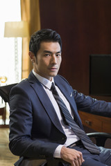 Fototapeta premium Portrait of successful businessman in study