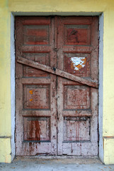 Boarded up front door