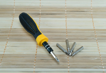 screw driver on bamboo matting - 99541880