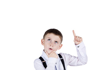 Thinking child-Portrait of a little boy thinking deeply and pointing up about something with hand...