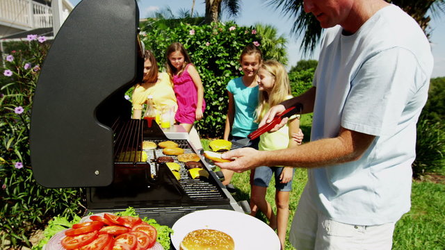 Outdoor Grill Food Cooking Healthy Lifestyle Caucasian Family Bright Clothes 
