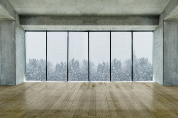 Modern lofty interior with large windows with snow and tree view