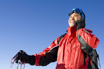 Young man in ski gear talking on his mobile phone