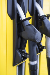 gun fuel pump at a gas station
