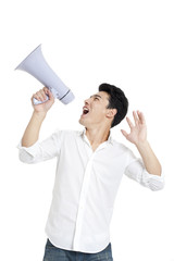 Young man cheering through a megaphone