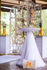 Table and arch at wedding ceremony