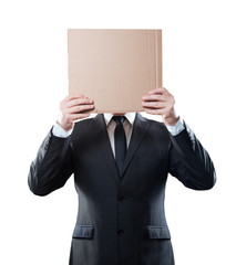 Businessman holding cardboard on white background. Clipping path