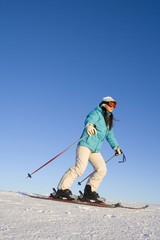 Young woman posing with ski equipment