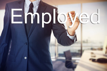 the businessman in the office is writing on the transparent board : employed