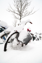 Bicycles near the train station in Lund, Sweden, are covered in a thick layer of snow on a cold winter day after a snow storm with extremely heavy snowfall in December.
